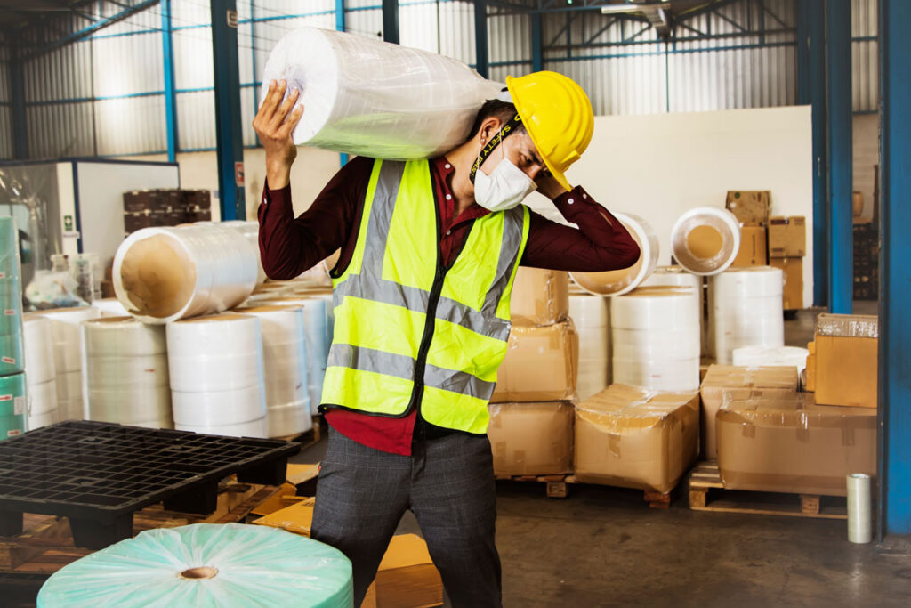 employee lifting a heavy item unassisted